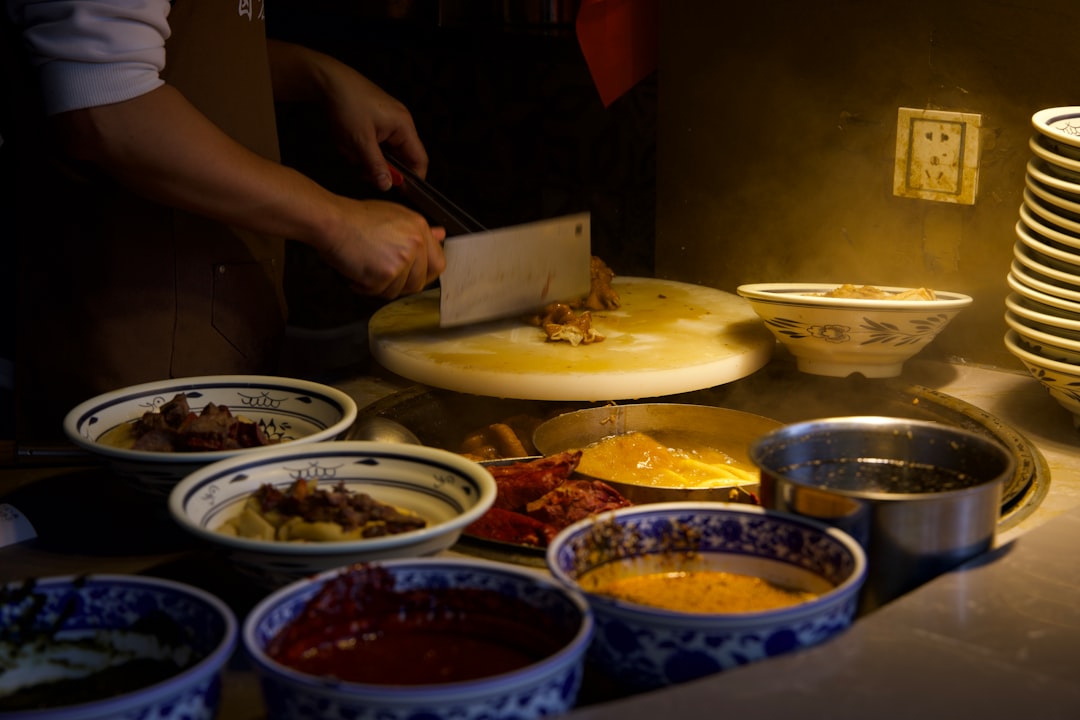 Professional chef working at kitchen station during service